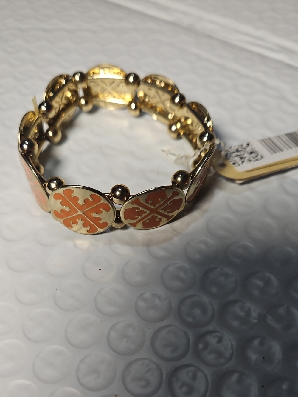 Tory Burch Gold-Tone Bracelet with Coral Orange Enamel Clover Motifs